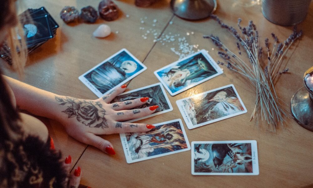 assorted tarot cards on table